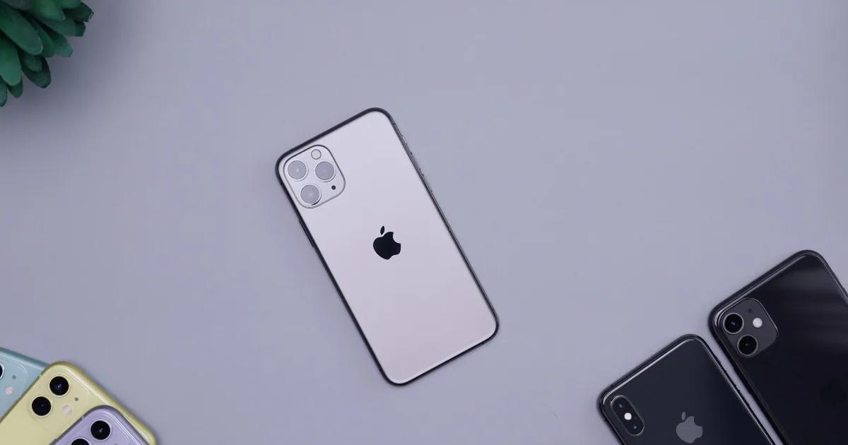 Image of a silver iPhone laying down among other iphones